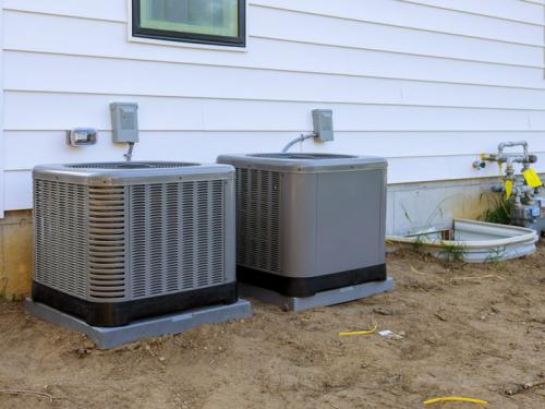 New air conditioning unit on a house.